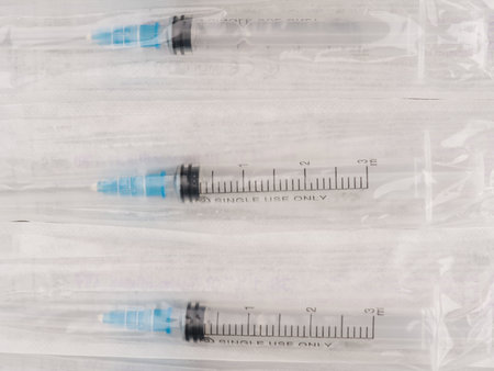 Three syringes in a package. closeup. view from above.の写真素材