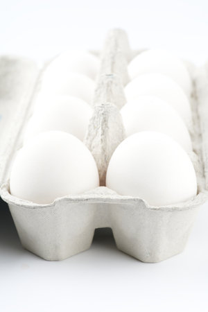 Chicken eggs in a package. Vertical snapshot. Closeupの写真素材
