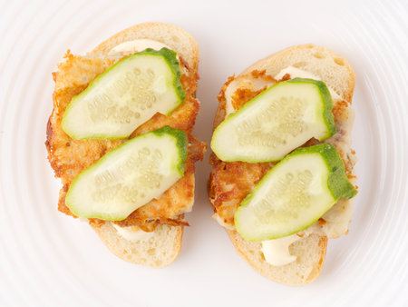 Two sandwiches with fish and cucumbers. top view.の写真素材