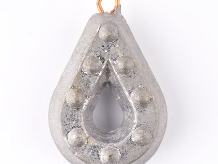 A fishing weight with an eye for attaching a fishing line on a white background. closeup.の写真素材