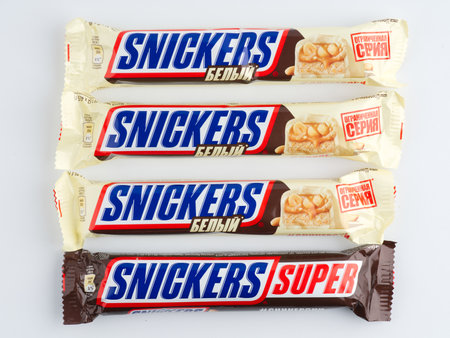 Moscow, Russia-September 16, 2022: Lots of Snickers bars on a white background. closeup.の写真素材