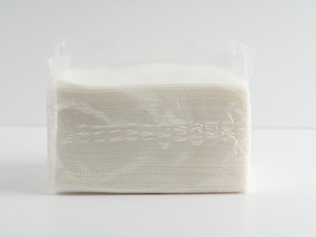 A pack of napkins on a white background.の写真素材