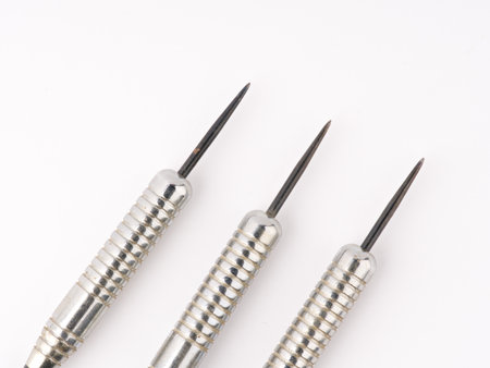 Three darts on a white background. closeup. Space for text.の写真素材