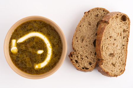 Soup with mayonnaise in the bowl and next to black bread. view from above.の写真素材