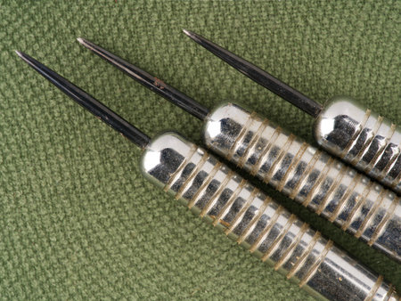 Darts on a green background. closeup. view from above.の写真素材