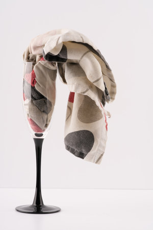 The concept of drunkenness. A glass with an untidy towel coming out of it.の写真素材