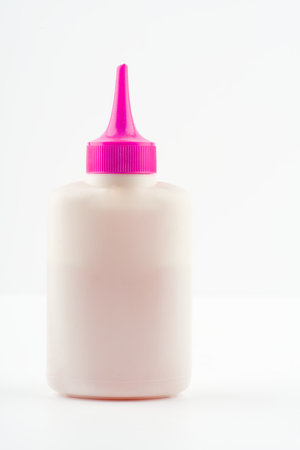 A tube of lubricant on a white background. Space for text. Vertical snapshotの写真素材