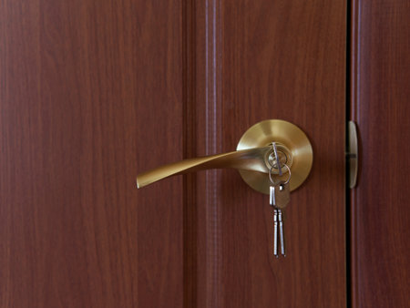 Door handle and lock with keys. Closeの写真素材