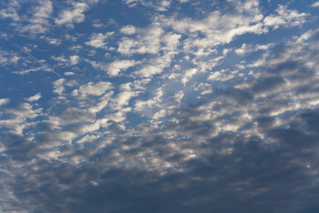 There are many small white clouds in the blue skyの写真素材