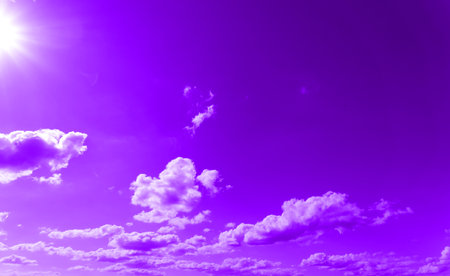 The texture is bright purple from clouds in the sky and the bright sunの写真素材