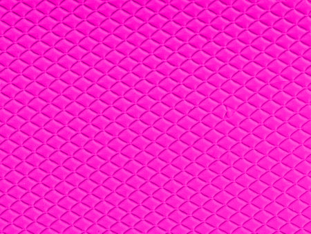 Texture of dark blue small squares on a pink background. Closeupの写真素材