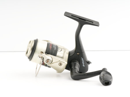 Moscow, Russia-October 16, 2022: Fishing reel on a white background. Closeupのeditorial素材