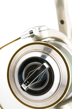 Moscow, Russia-October 16, 2022: Branded fishing reel on a white background. The spool is visible. Closeupのeditorial素材
