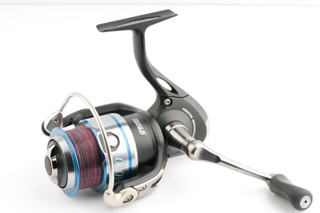 Moscow, Russia-October 16, 2022: Branded fishing reel designed for sports on a white backgroundのeditorial素材