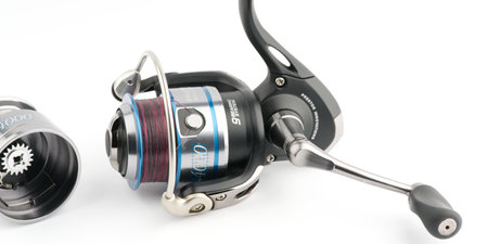 Moscow, Russia-October 16, 2022: Branded fishing reel designed for sports on a white background. There is a spare spool nearbyのeditorial素材