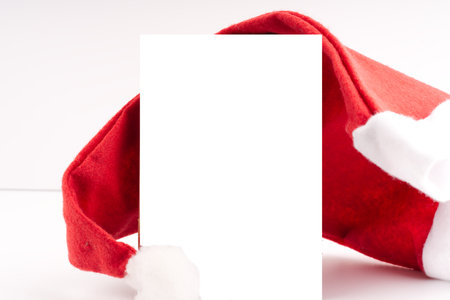 Mockup with Santa Claus hat on a white background. Space for textの写真素材