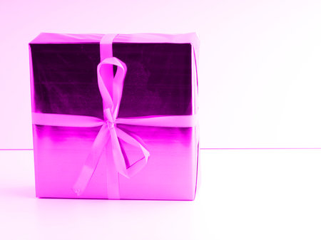 A square box with a pink New Year giftの写真素材