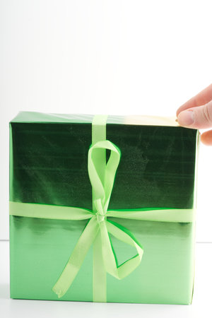 A green New Years gift. Vertical snapshotの写真素材