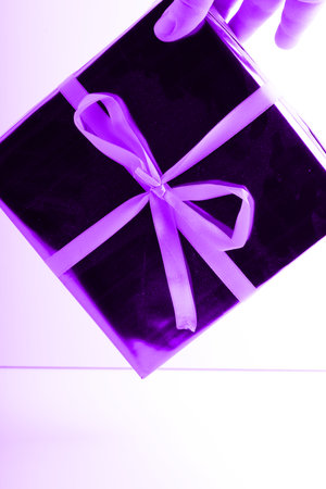 A New Years gift in your hand. Vertical snapshotの写真素材