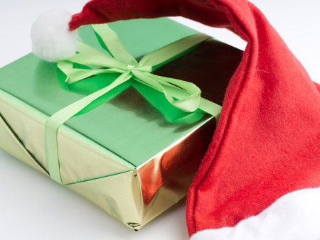 A green New Year gift and a Santa Claus hatの写真素材