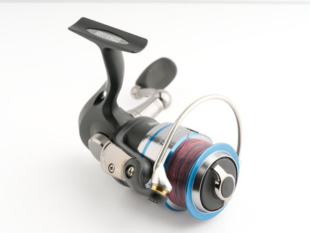 Moscow, Russia-October 16, 2022: Branded fishing reel designed for sports on a white backgroundのeditorial素材