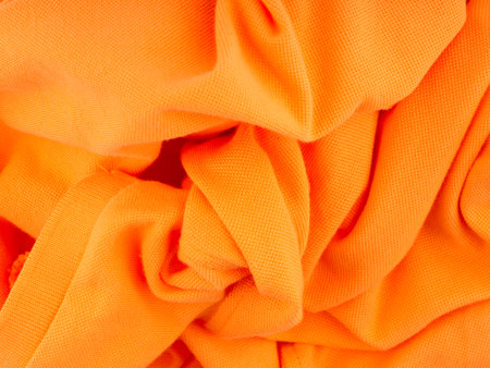The bright texture of the fabric is orange. Top viewの写真素材