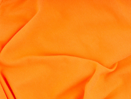 The bright texture of the fabric is orange. Top viewの写真素材