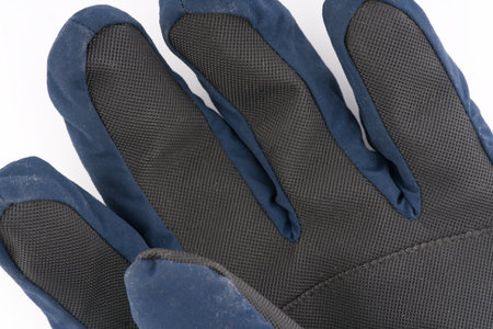 Warm winter glove on a white background closeupの写真素材