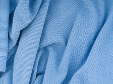The texture of the crumpled blue fabric forming a pattern. Top viewの写真素材