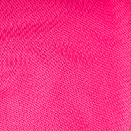 The bright texture of the fabric is pink. Top viewの写真素材