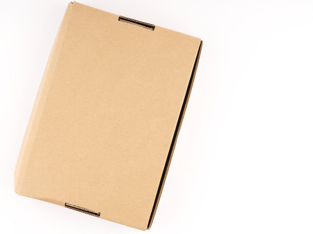 Closed cardboard box on a white background. View from above. Place for textの写真素材