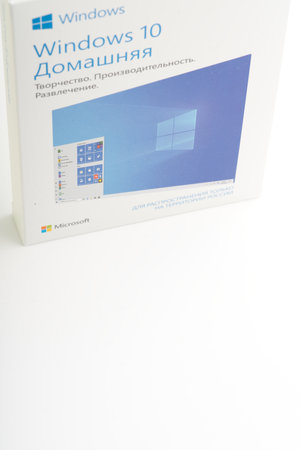 Moscow, Russia-October 16, 2022: A box with an operating system for a Windows 10 computer. On a white background. Vertical shot. Space for textのeditorial素材