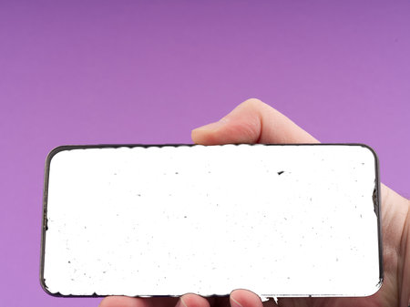 Mockup with a mobile phone in hand. Closeup. Space for textの写真素材