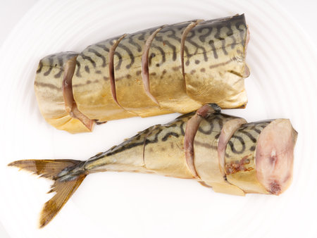 Cold smoked chopped fish on a white plateの写真素材