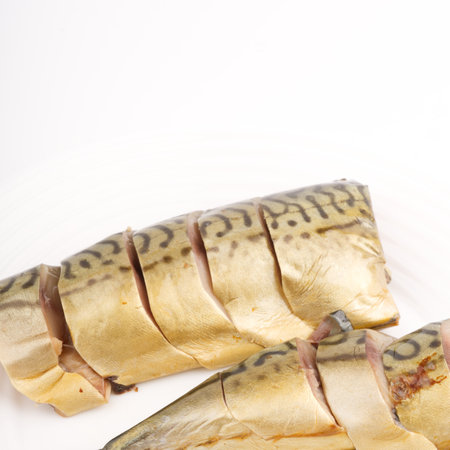 Cold smoked chopped fish on a white plate. Space for textの写真素材