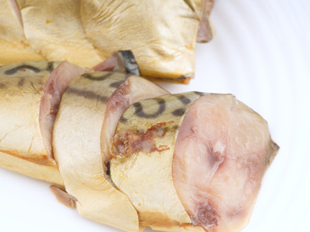 Cold smoked chopped fish on a white plate. Closeupの写真素材
