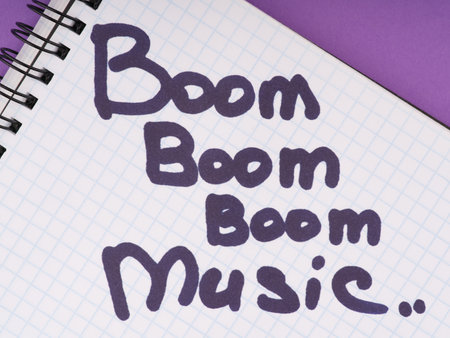 The concept of electronic music. Rhythms and basses. The inscription on the notebook sheet boom musicの写真素材