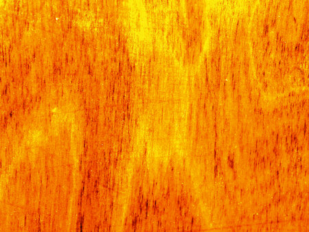 A complex texture of wood with a bright fiery color. Closeupの写真素材