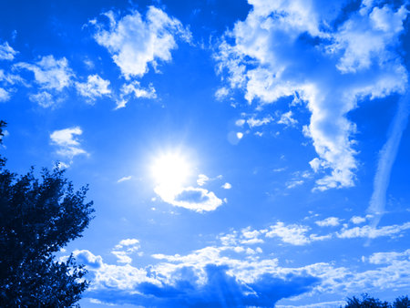 The texture is bright blue from clouds in the sky and the bright sunの写真素材