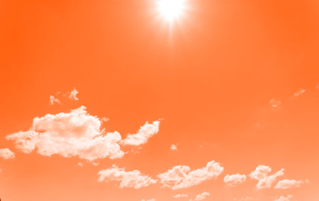 The texture is orange from clouds in the sky and the bright sunの写真素材