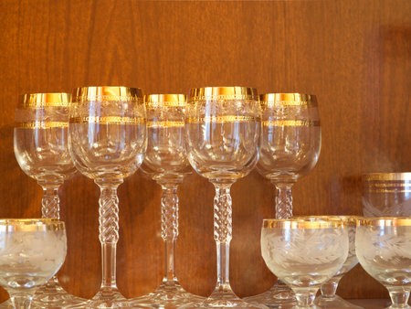 MOSCOW, Russia - November 22, 2022: Festive crystal glasses for alcohol inside the cabinet. Different sizes. Closeupのeditorial素材