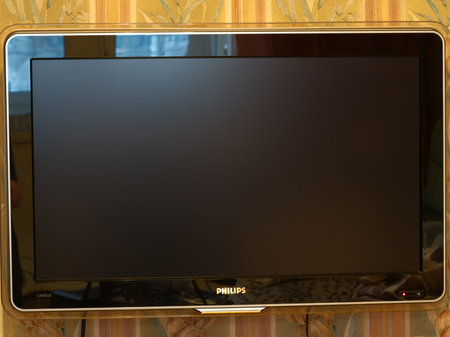 MOSCOW, Russia - November 22, 2022: Large LCD TV on the wall in the room. Closeupのeditorial素材