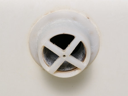 The concept of sewerage. The water drain hole closeupの写真素材