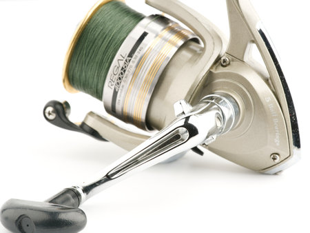 Moscow, Russia-October 16, 2022: Branded fishing reel on a white backgroundのeditorial素材