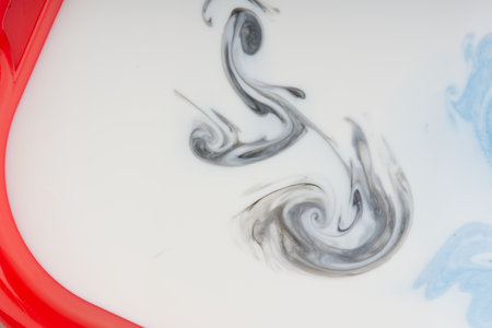Abstract patterns from paint in white liquid. Closeupの写真素材