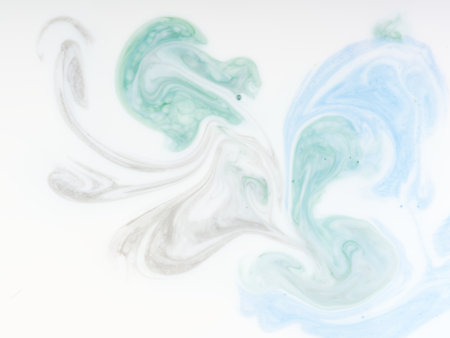 Abstract background in the form of paints dissolved in a white liquid. Closeupの写真素材