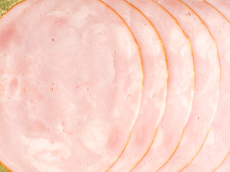 Sausage sliced into pieces lies nearby. Closeup. View from aboveの写真素材