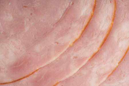 Sausage sliced into pieces lies nearby. Closeup. View from aboveの写真素材