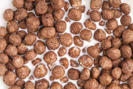 Chocolate breakfast in the form of balls in milk. Closeupの写真素材