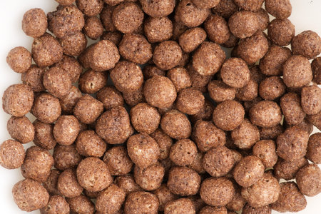 Chocolate breakfast in the form of balls in milk. Closeupの写真素材